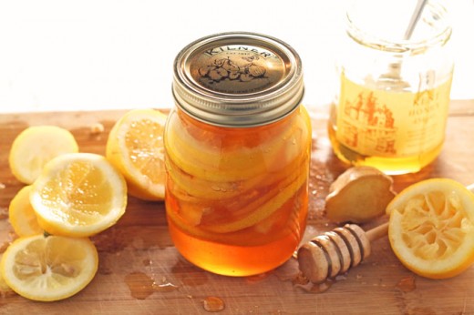 raw honey lemon and ginger in a jar. Cold remedy.